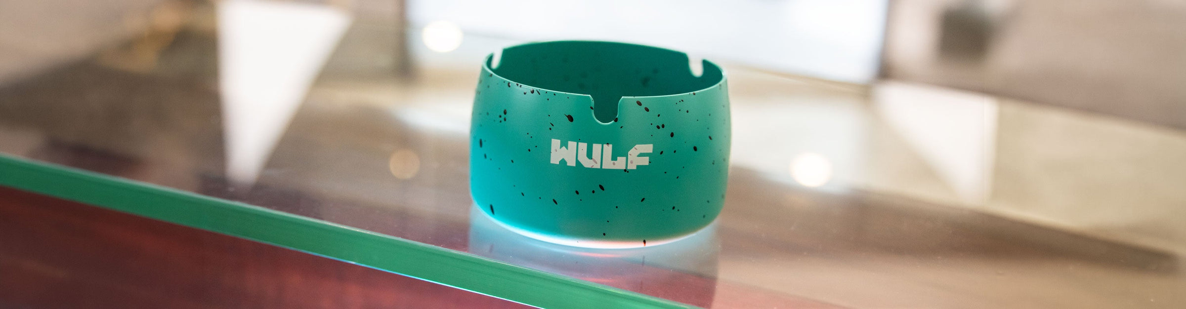 Wulf Cache ashtray on glass display surface 